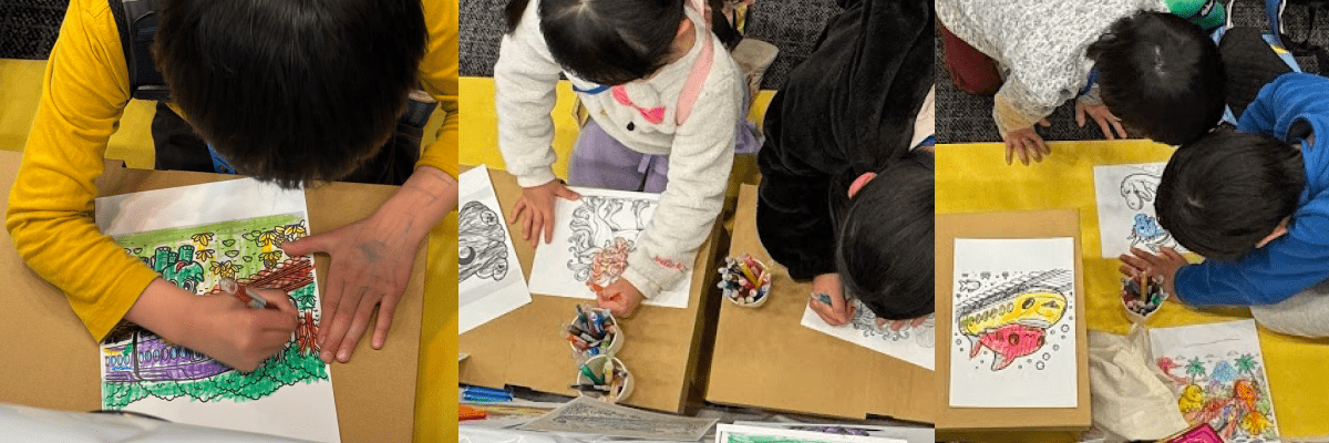 イベントで自分で作ったぬりえを塗っているこども達